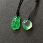 Twin Green Forms paired pendants on black cords, view 3
