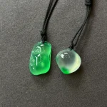 Twin Green Forms paired pendants on black cords, view 4