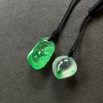 Twin Green Forms paired pendants on black cords, view 5